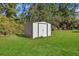 Metal storage shed in well-maintained backyard at 222 Rod Ln, Davenport, FL 33837