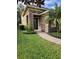 Home's exterior features stone facade and walkway at 4759 Lathloa Loop, Lakeland, FL 33811