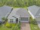 Aerial view of single-Gathering home with driveway and landscaping at 5151 Twin Lakes Blvd, Saint Cloud, FL 34772