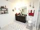 Double vanity bathroom with granite countertop and decorative accents at 605 Sarner Pass Way, Winter Haven, FL 33881