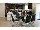 Modern dining area with black and white chairs at 605 Sarner Pass Way, Winter Haven, FL 33881