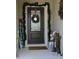 Inviting front door entrance with festive holiday decor at 605 Sarner Pass Way, Winter Haven, FL 33881