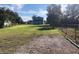 Spacious backyard with a large grassy area, providing ample space for outdoor activities at 1300 Lucerne Loop Ne Rd, Winter Haven, FL 33881