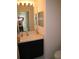 Well-lit bathroom with single sink and large mirror at 1300 Lucerne Loop Ne Rd, Winter Haven, FL 33881