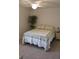 Bedroom with double bed, nightstand, and plant at 1300 Lucerne Loop Ne Rd, Winter Haven, FL 33881