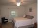 Bedroom with queen bed and a chair at 1300 Lucerne Loop Ne Rd, Winter Haven, FL 33881