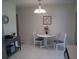 Small dining area with white table and chairs at 1300 Lucerne Loop Ne Rd, Winter Haven, FL 33881