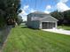 House exterior with grassy yard and garage at 1300 Lucerne Loop Ne Rd, Winter Haven, FL 33881