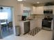 Bright kitchen with stainless steel appliances at 1300 Lucerne Loop Ne Rd, Winter Haven, FL 33881