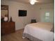 Large main bedroom with a comfortable bed, dresser, and ceiling fan at 1300 Lucerne Loop Ne Rd, Winter Haven, FL 33881