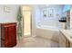 Bathroom features a soaking tub, shower, and double sink vanity at 5643 Fischer Dr, Lakeland, FL 33812