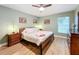 Serene bedroom with a king-size bed and light green walls at 5643 Fischer Dr, Lakeland, FL 33812