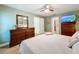 Bright bedroom with king-size bed and large dresser, offering ample space at 5643 Fischer Dr, Lakeland, FL 33812