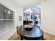 Modern dining room with an oval table and view into the kitchen at 5643 Fischer Dr, Lakeland, FL 33812