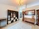 Dining room featuring a wooden hutch, shelving unit, and a grandfather clock at 5643 Fischer Dr, Lakeland, FL 33812