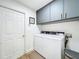 Laundry room with washer, dryer, and extra storage at 5643 Fischer Dr, Lakeland, FL 33812