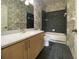 Bathroom features a vanity with dual sinks, tub-shower, and grey tiled floors at 1202 Ashton Palms Dr # 6, Lake Wales, FL 33859