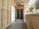 Bathroom showcasing light wood cabinets, grey tile floors, and a glass shower at 1202 Ashton Palms Dr # 6, Lake Wales, FL 33859