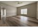 A bedroom including wood-style floors, light grey walls, and a ceiling fan at 1202 Ashton Palms Dr # 6, Lake Wales, FL 33859