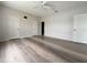 Large bedroom featuring wood floors, three doors and a ceiling fan at 1202 Ashton Palms Dr # 6, Lake Wales, FL 33859