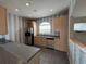 Bright kitchen features stainless steel appliances, light wood cabinets, and tiled floors at 1202 Ashton Palms Dr # 6, Lake Wales, FL 33859