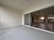Enclosed lanai with neutral walls and a sliding glass door to the living area at 1202 Ashton Palms Dr # 6, Lake Wales, FL 33859