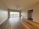 Spacious living room with wood flooring and a sliding glass door to the outdoors at 1202 Ashton Palms Dr # 6, Lake Wales, FL 33859