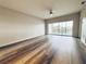 Large living room featuring sliding glass doors with views and wood-look flooring at 1202 Ashton Palms Dr # 6, Lake Wales, FL 33859