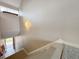A staircase that leads to a landing with white walls, carpeted stairs, and wood trim at 1202 Ashton Palms Dr # 6, Lake Wales, FL 33859