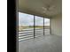 Screened lanai overlooking a serene lake and lush greenery at 1202 Ashton Palms Dr # 6, Lake Wales, FL 33859