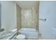 Bathroom featuring a tub with ceramic tile, chrome fixtures, and a granite vanity at 1476 Leamington Lane, Winter Haven, FL 33884