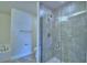 Updated bathroom with glass-enclosed shower, chrome fixtures, and ceramic tile at 1476 Leamington Lane, Winter Haven, FL 33884