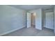 Neutral bedroom with a closet and a door at 1476 Leamington Lane, Winter Haven, FL 33884