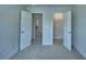 Neutral bedroom with closets and hallway access at 1476 Leamington Lane, Winter Haven, FL 33884