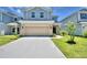 Charming two-story home with a well-maintained lawn and inviting curb appeal at 1476 Leamington Lane, Winter Haven, FL 33884