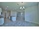 Open-concept kitchen with granite countertops and an island, seamlessly connects to the spacious living area at 1476 Leamington Lane, Winter Haven, FL 33884