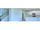 Bright kitchen with white cabinets, stainless steel appliances and island at 1476 Leamington Lane, Winter Haven, FL 33884