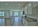 Spacious kitchen with granite countertops, stainless steel appliances and plenty of storage space at 1476 Leamington Lane, Winter Haven, FL 33884