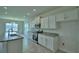 Well-lit kitchen with modern appliances and sleek countertops and cabinetry at 1476 Leamington Lane, Winter Haven, FL 33884