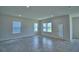 Bright living room featuring recessed lighting, tile flooring and multiple windows for ample natural light at 1476 Leamington Lane, Winter Haven, FL 33884