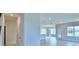 Bright, open-concept living space with neutral walls and abundant natural light at 1476 Leamington Lane, Winter Haven, FL 33884