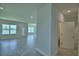 Open concept floorplan features an expansive living room and dining room area with neutral paint and tile floors at 1476 Leamington Lane, Winter Haven, FL 33884
