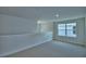 Comfortable loft area with plush carpeting, a large window and pendant lighting at 1476 Leamington Lane, Winter Haven, FL 33884