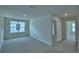 Well-lit loft featuring plush carpet, natural light, and convenient access to other rooms at 1476 Leamington Lane, Winter Haven, FL 33884