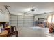 Spacious garage with ample storage space, shelving, and a large garage door at 2014 Bardmoor, Winter Haven, FL 33884