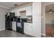Efficient kitchen layout, black appliances, and sleek counter tops for easy meal preparation at 2014 Bardmoor, Winter Haven, FL 33884