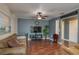 Inviting living room features a cozy couch, sleek TV, and stylish flooring at 2014 Bardmoor, Winter Haven, FL 33884