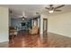 Spacious living room showcases a sofa, TV, ceiling fans, and beautiful flooring at 2014 Bardmoor, Winter Haven, FL 33884