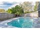 Backyard pool with deck and privacy fence offering a serene retreat at 2014 Bardmoor, Winter Haven, FL 33884