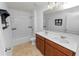 Bathroom with double vanity, bathtub and tile flooring at 3537 Julius Estates Blvd, Winter Haven, FL 33881